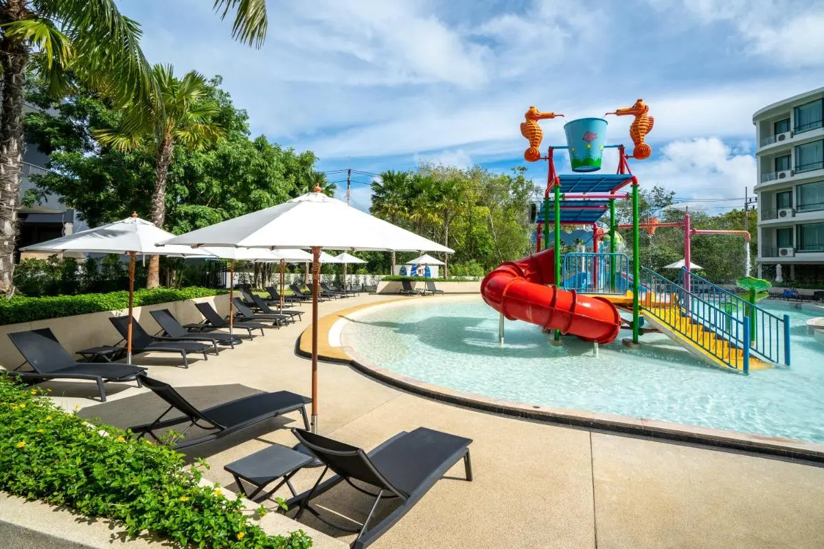 Outdoor Children’s Pool Area with Slides and Lounge Chairs Near Rawai Beach