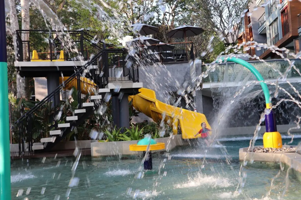 The Nature Phuket Outdoor Children’s Water Play Area with Slide and Shaded Seating at Patong Beach