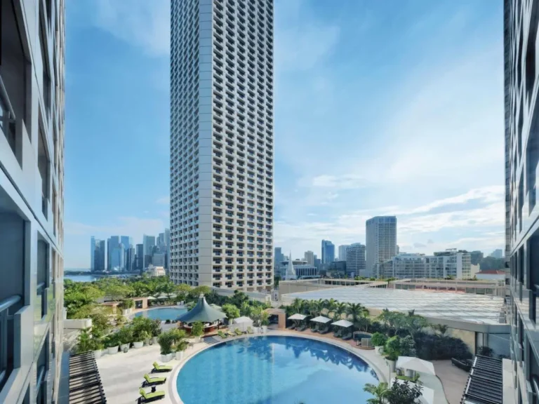 Outdoor Circular Pool Area with Lounge Seating and Pavilion in City Hall Urban Setting