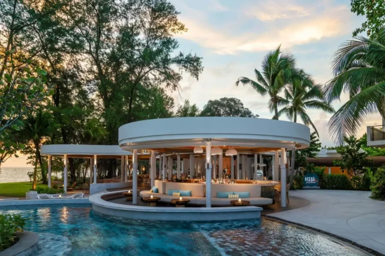 Outdoor Circular Pool Bar with Seating and Tropical Views at Mai Khao Beach