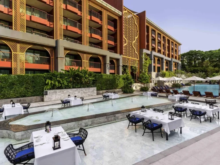 Outdoor Dining and Swimming Pool Area with Decorative Facade at Karon Beach