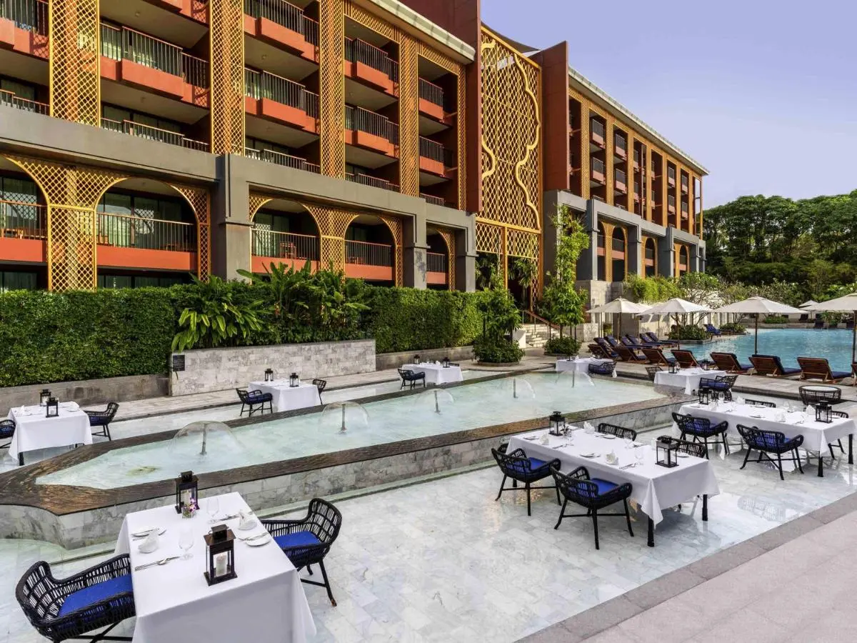 Outdoor Dining and Swimming Pool Area with Decorative Facade at Karon Beach