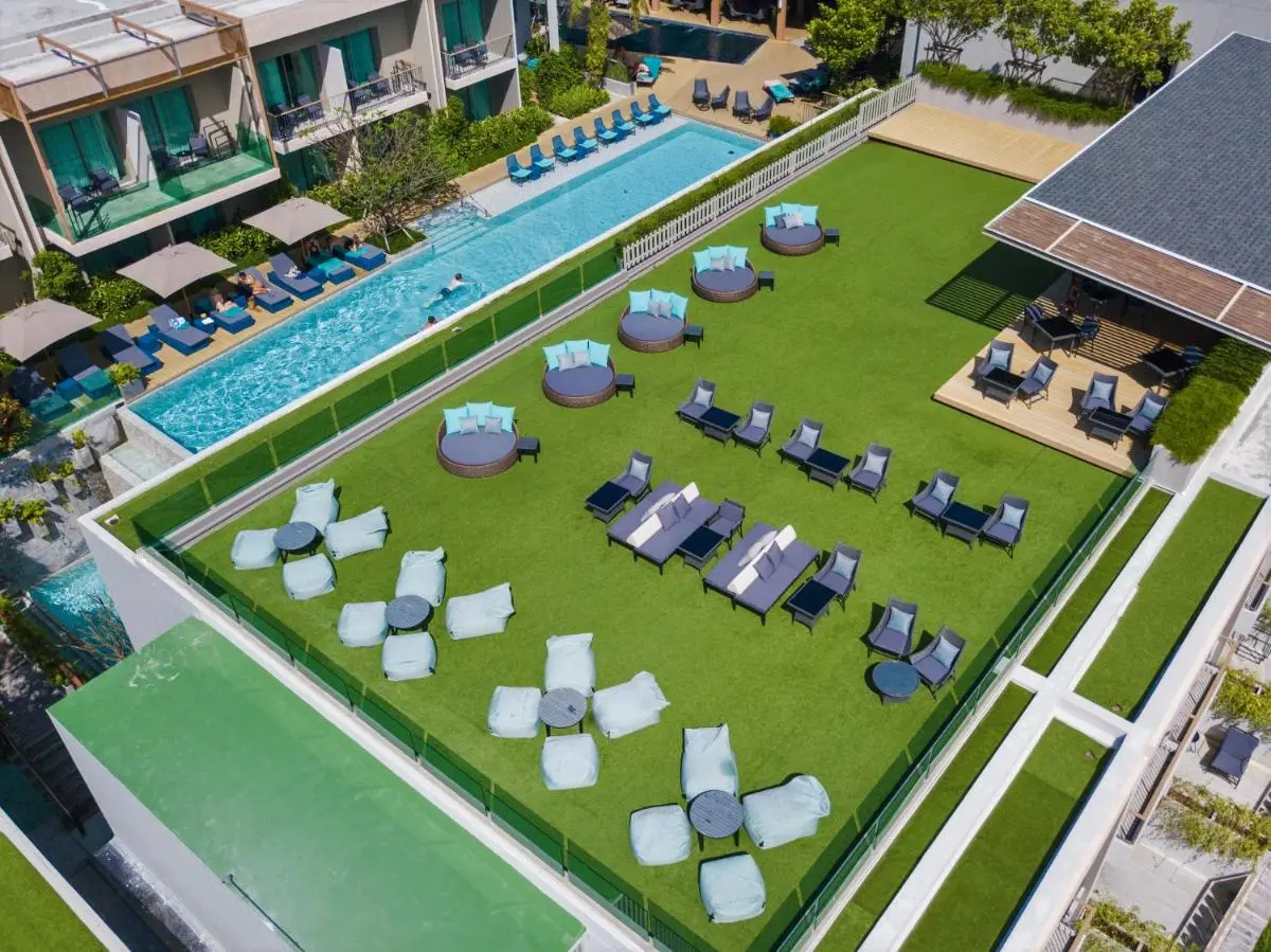 AtEase Phuket Patong Outdoor Elevated Pool and Lounge Area with Jacuzzi and Seating at Patong Beach