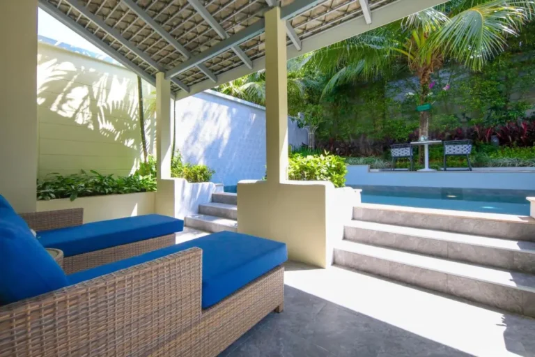 Outdoor Elevated Pool with Covered Patio and Tropical Garden Seating Area in Phuket Town