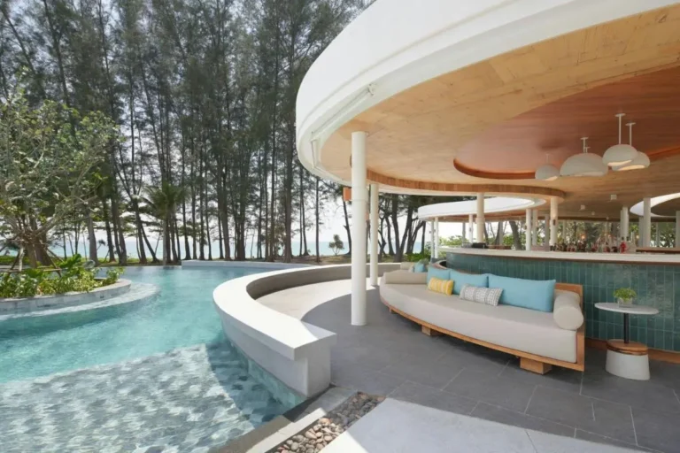 Outdoor Freeform Pool and Covered Seating Area with Bar at Mai Khao Beach