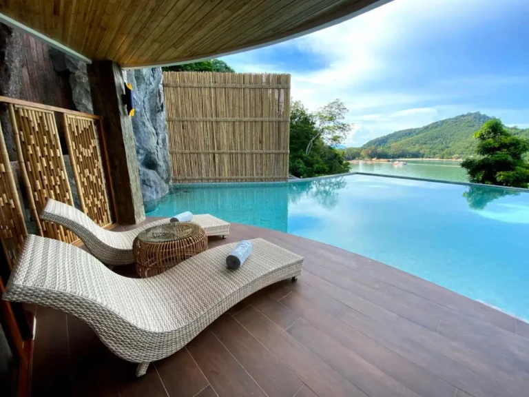 Outdoor Infinity Pool and Lounge Area Overlooking Scenic Water Views in Phuket Town