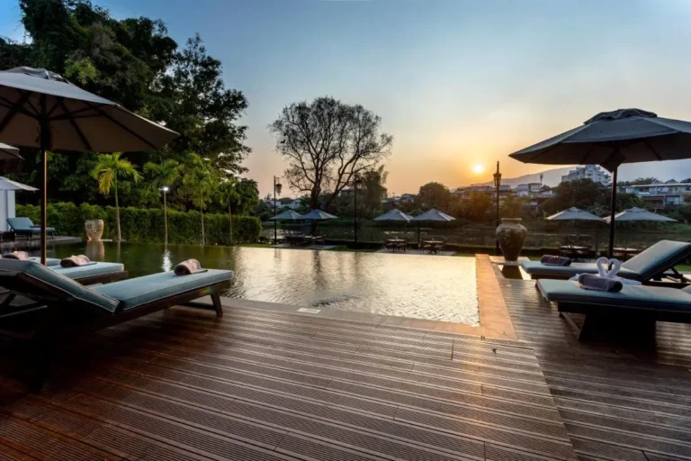 Outdoor Infinity Pool and Relaxation Area with Lounge Chairs in Fa Ham Chiang Mai