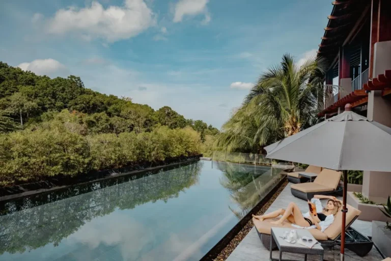 Outdoor Infinity Pool and Relaxation Area with Scenic Views at Patong Beach