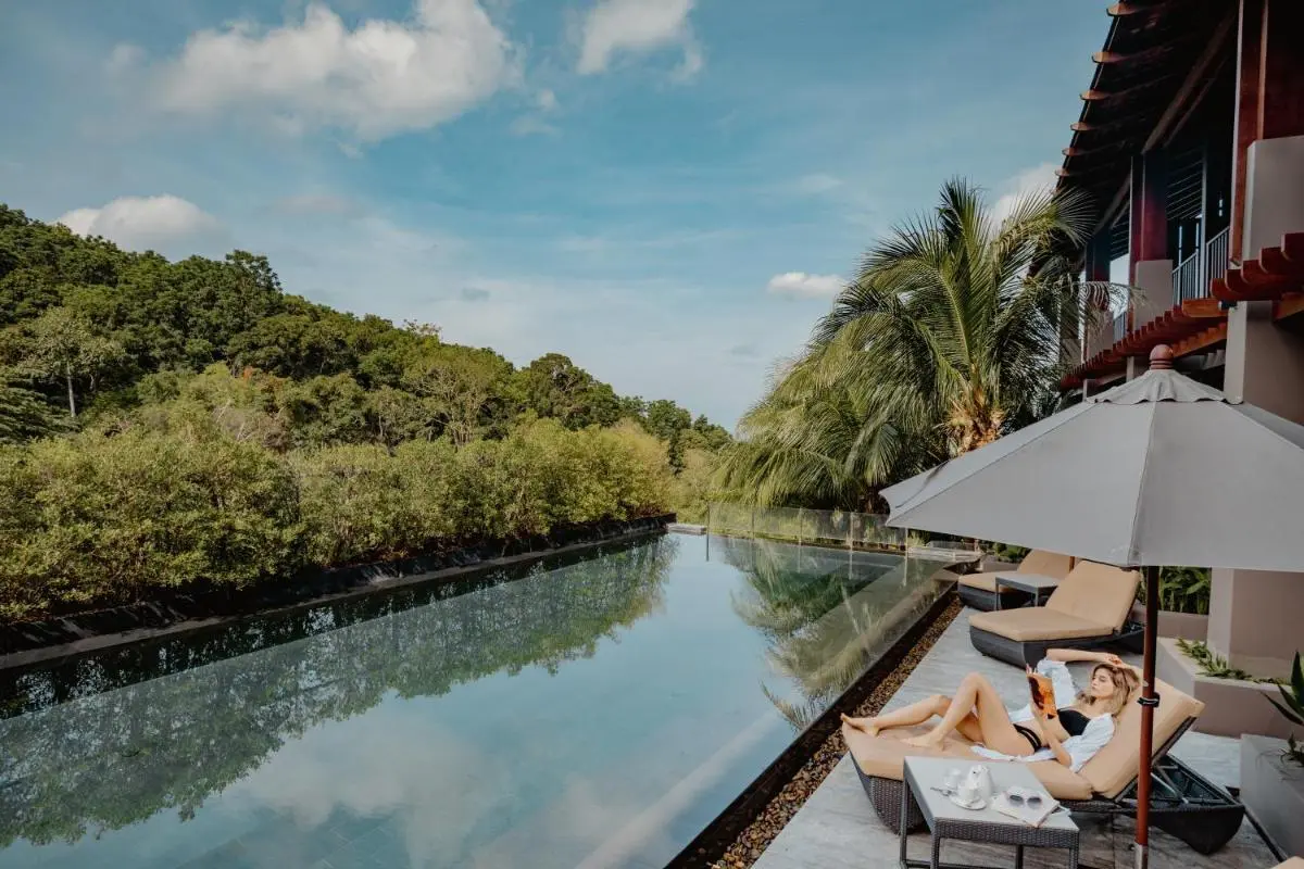 Outdoor Infinity Pool and Relaxation Area with Scenic Views at Patong Beach
