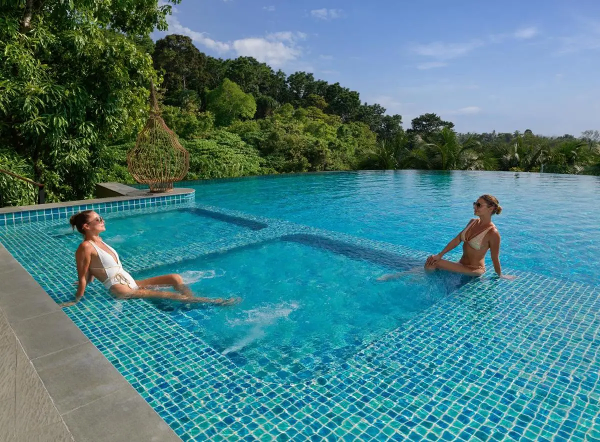 Outdoor Infinity Pool with Built-In Jacuzzi and Tropical Surroundings at Patong Beach