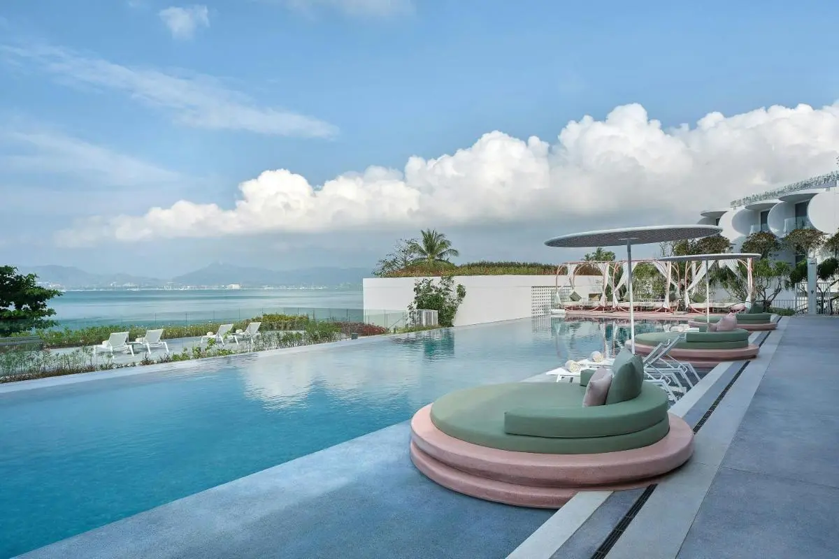 Veranda Resort Phuket, Autograph Collection Outdoor Infinity Pool with Lounge Beds and Ocean Views at Panwa Beach