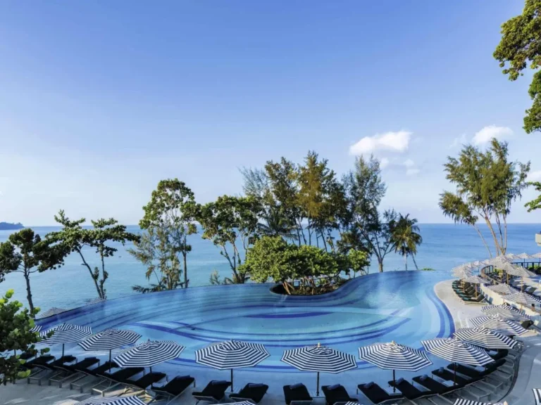 Outdoor Infinity Pool with Ocean View and Curved Blue Tile Design at Nai Thon Beach