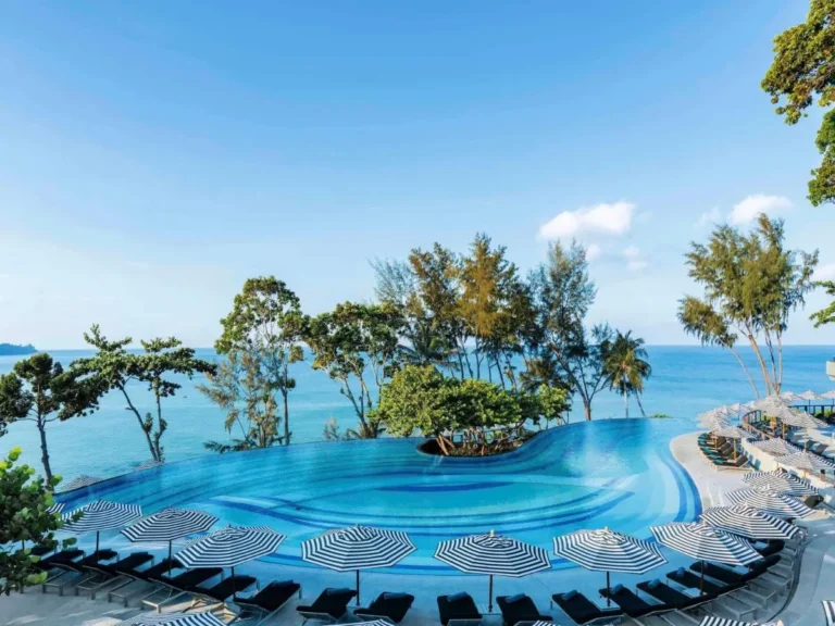 Outdoor Infinity Pool with Ocean Views and Curved Blue Tile Design at Nai Thon Beach