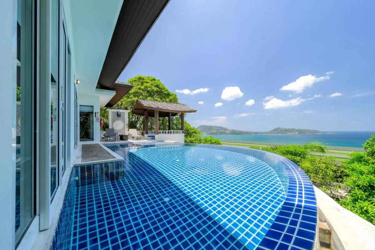 Outdoor Infinity Pool with Ocean Views and Relaxation Pavilion at Patong Beach