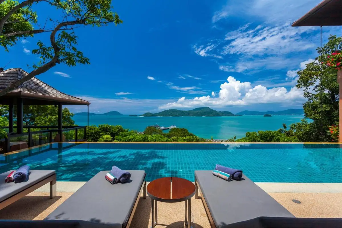 Outdoor Infinity Pool with Panoramic Sea Views and Comfortable Lounge Seating at Panwa Beach