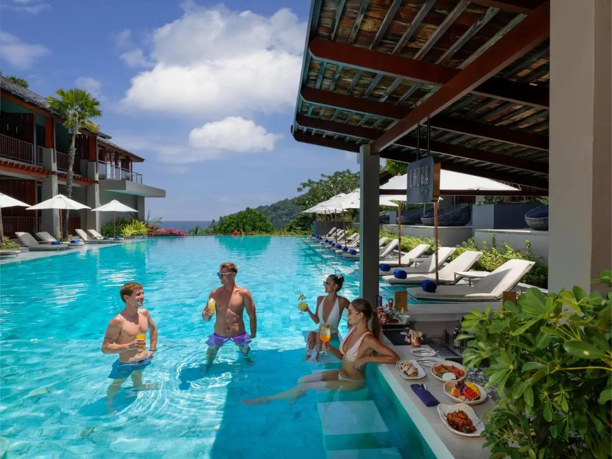 Avista Hideaway Phuket Patong - MGallery Outdoor Infinity Pool with Swim-Up Bar and Lounge Chairs at Patong Beach