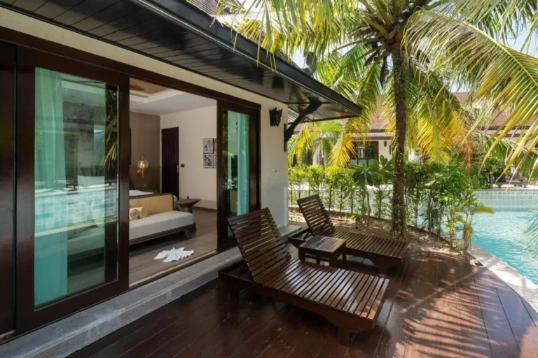 Outdoor Patio and Pool Area with Wooden Lounge Chairs in Thalang
