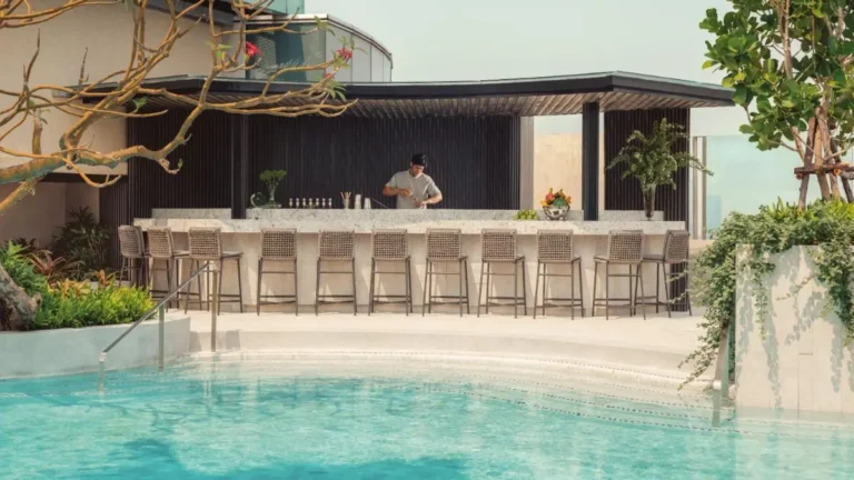 Outdoor Pool and Bar Area with Modern Seating and Landscaping in Pathumwan Bangkok