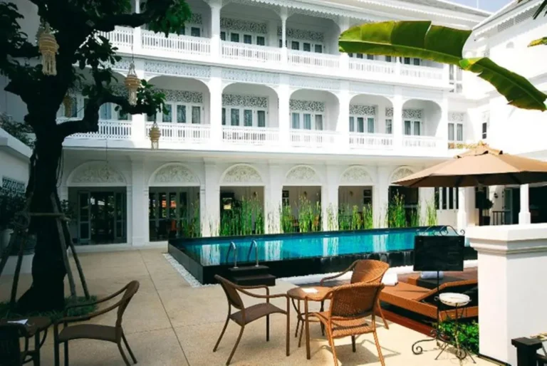 Outdoor Pool and Courtyard Seating Area with Balconies in Chang Khlan Chiang Mai