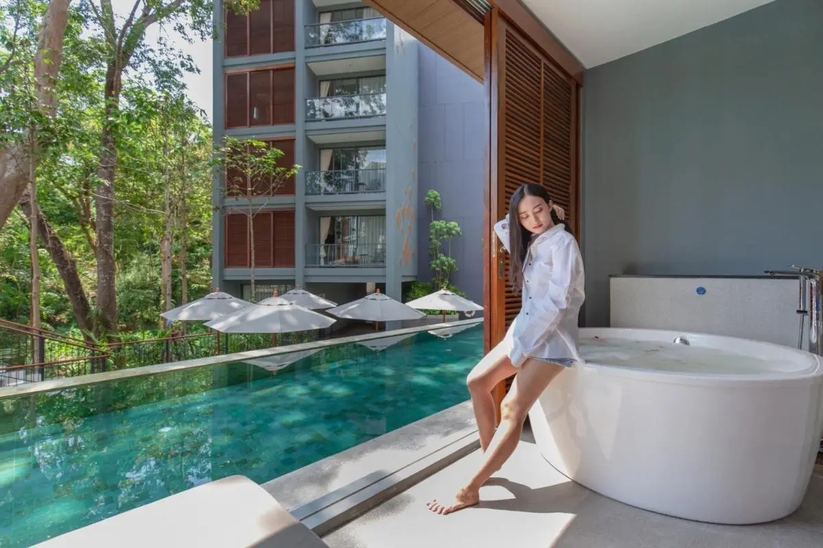 Phuket Province Outdoor Pool and Freestanding Bathtub with Balcony Overlooking Lush Greenery at Patong Beach