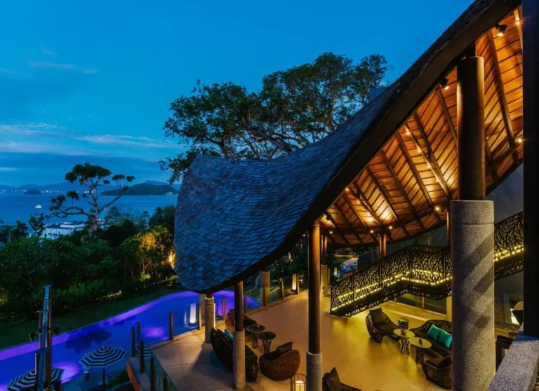 Outdoor Pool and Relaxation Area with Curved Wooden Roof at Panwa Beach