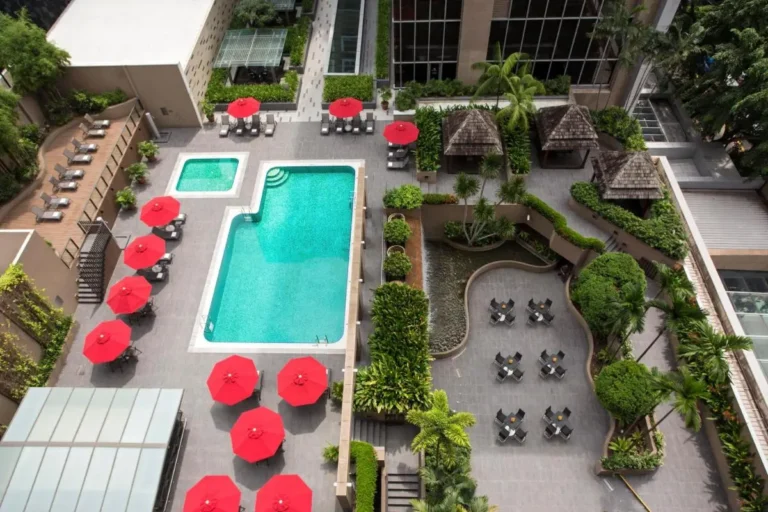 Outdoor Pool and Relaxation Area with Seating and Water Features Near City Hall