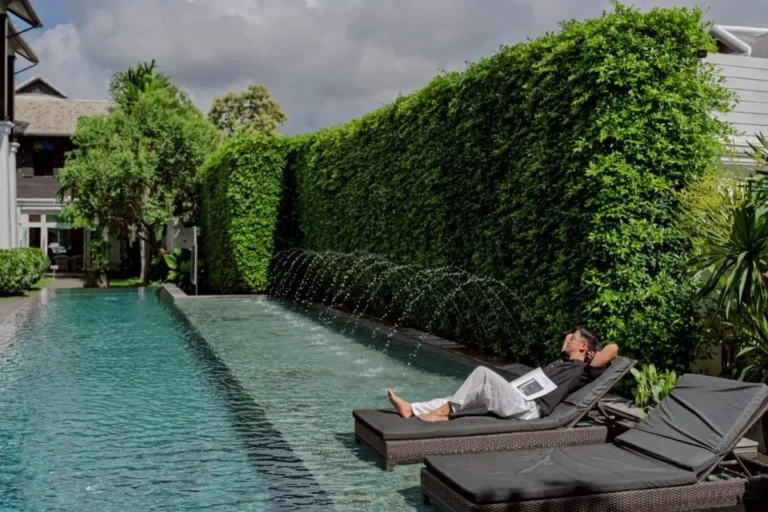 Outdoor Pool and Relaxation Area with Water Jets and Lounge Chairs in Phra Sing Chiang Mai