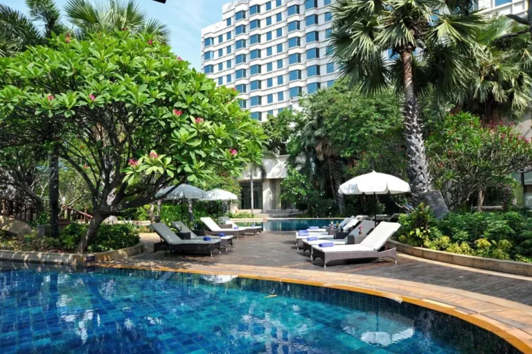 Outdoor Pool and Spa Area with Lounge Chairs and Greenery in Laksi Bangkok