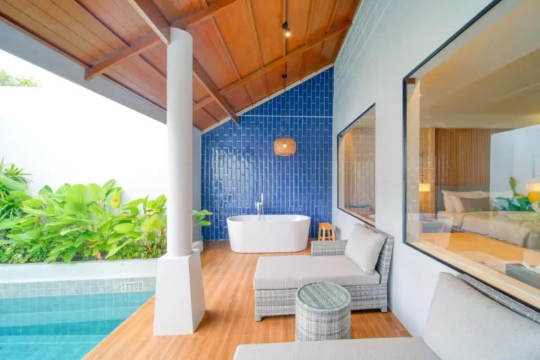 Outdoor Pool and Spa Area with Wooden Deck and Indoor View in Thalang