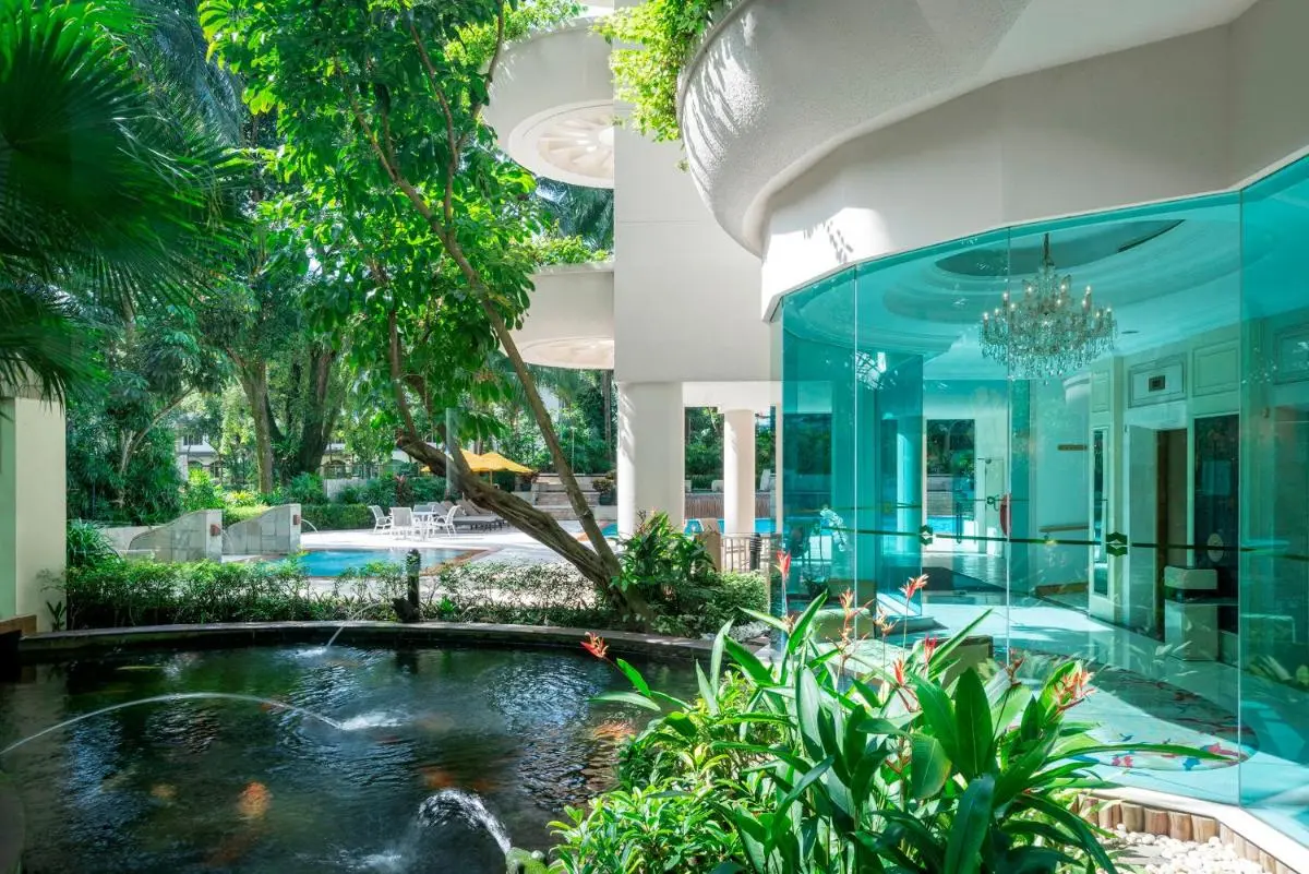 Outdoor Pool and Water Features with Seating Area in Singapore Wellness Setting