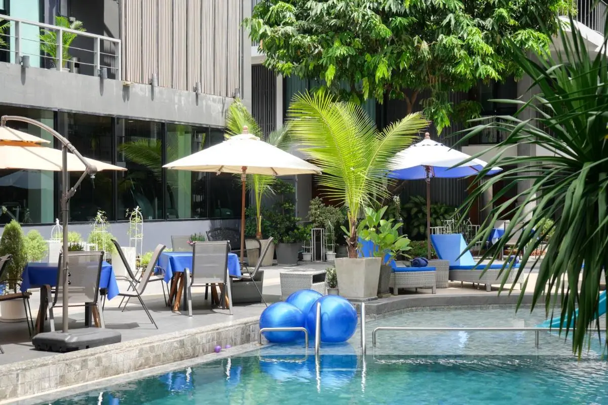 Outdoor Pool Area with Aquatic Fitness Equipment and Shaded Seating in Chang Phueak Chiang Mai