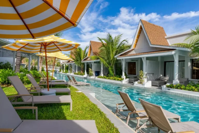 Outdoor Pool Area with Bungalows and Lounge Seating in Thalang Resort Setting
