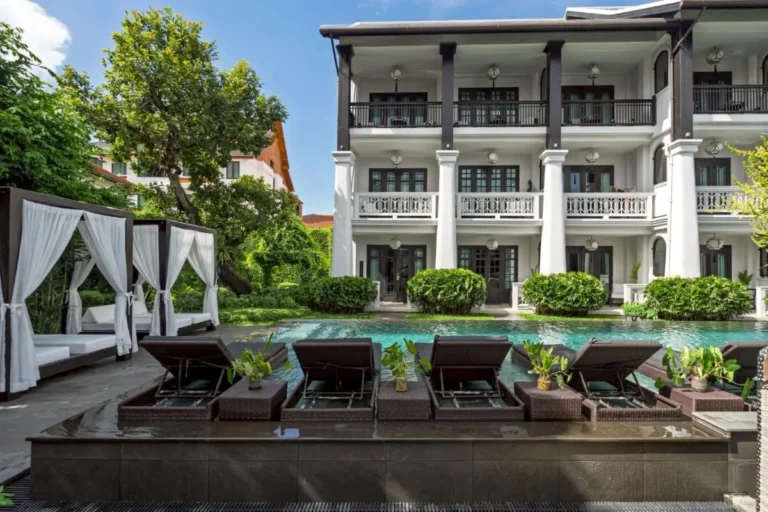 Outdoor Pool Area with Cabana Daybeds and Lounge Chairs in Phra Sing Chiang Mai