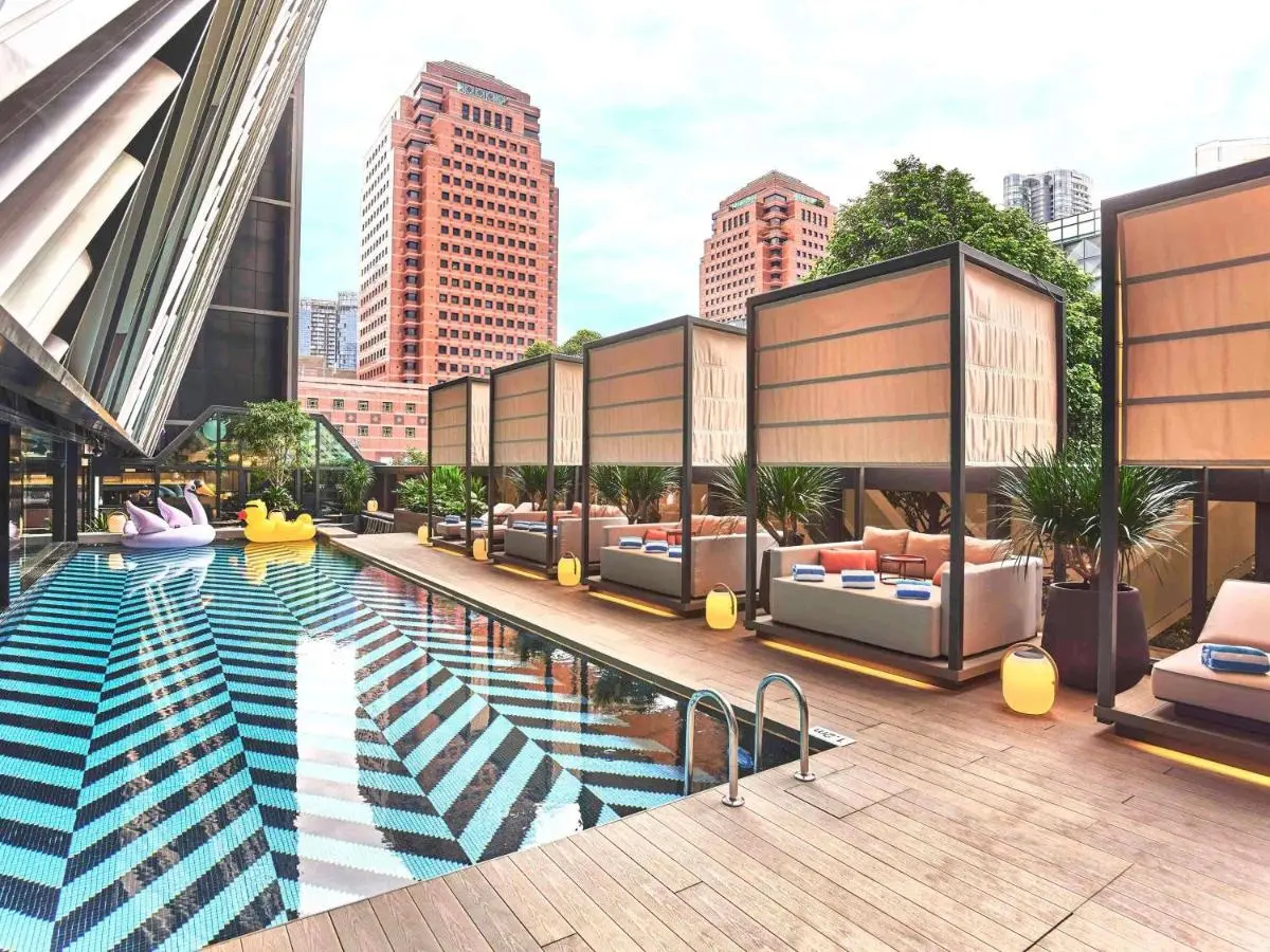 Outdoor Pool Area with Cabanas and City Views in Orchard