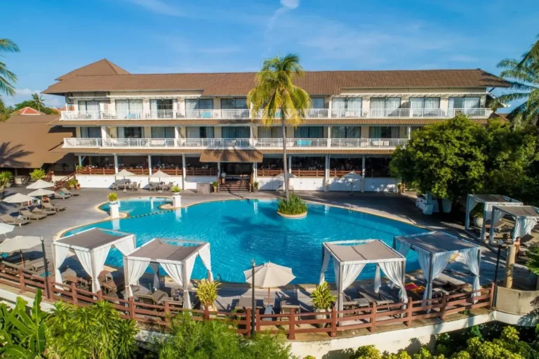 Outdoor Pool Area with Cabanas and Lounge Chairs at Panwa Beach Resort