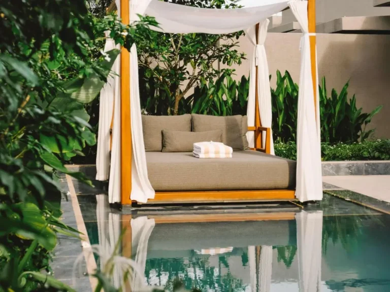 Outdoor Pool Area with Canopy Daybed and Water Feature on Sentosa Island