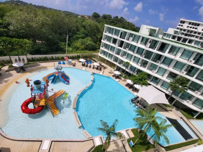 Outdoor Pool Area with Children’s Play Pool and Lounge Seating Near Rawai Beach