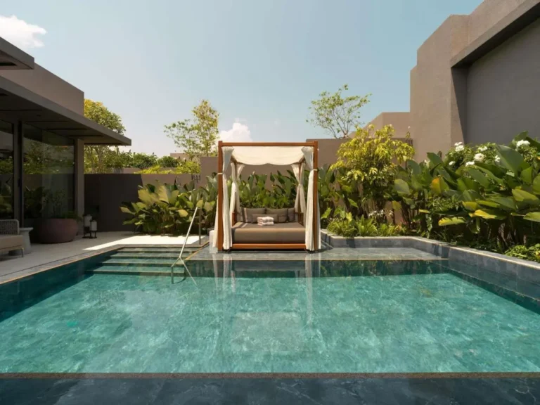 Outdoor Pool Area with Daybed and Greenery on Sentosa Island