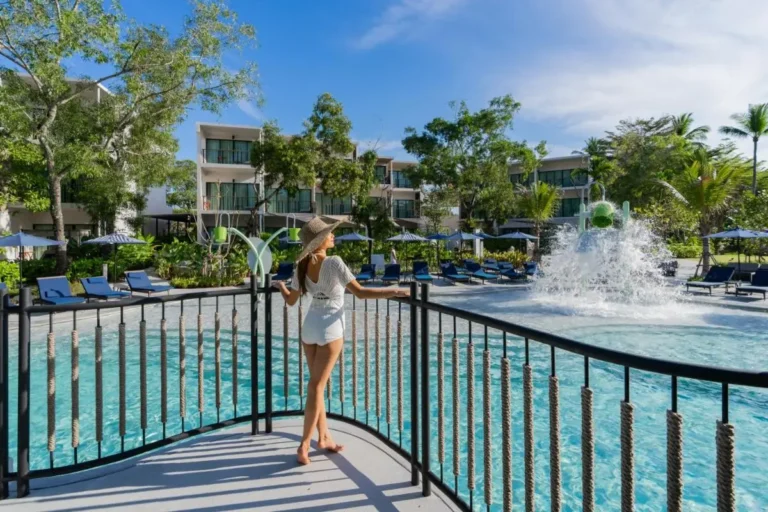 Outdoor Pool Area with Fountain and Lounge Chairs at Mai Khao Beach Resort