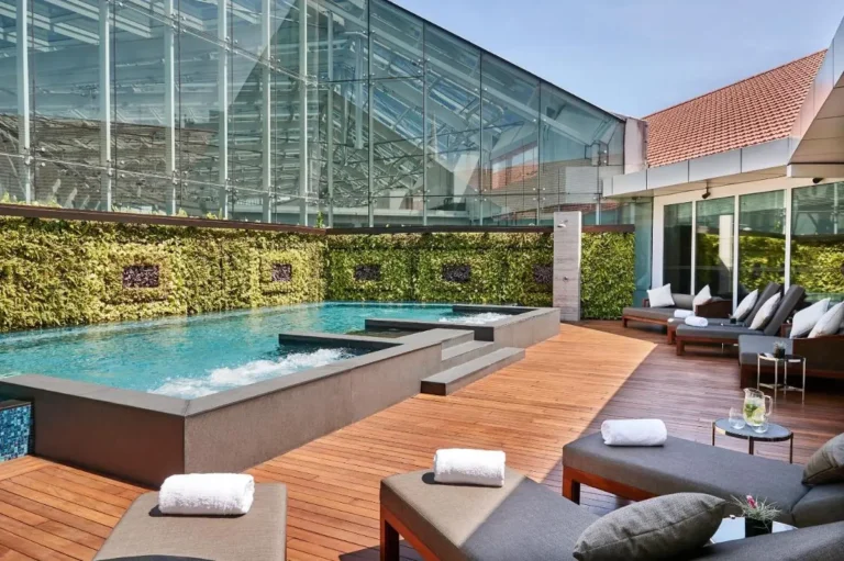 Outdoor Pool Area with Hydrotherapy Jets and Vertical Garden in City Hall