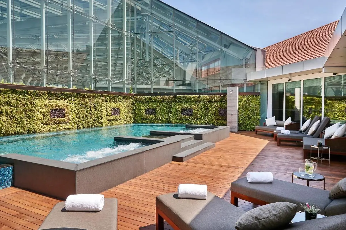 Outdoor Pool Area with Hydrotherapy Jets and Vertical Garden in City Hall