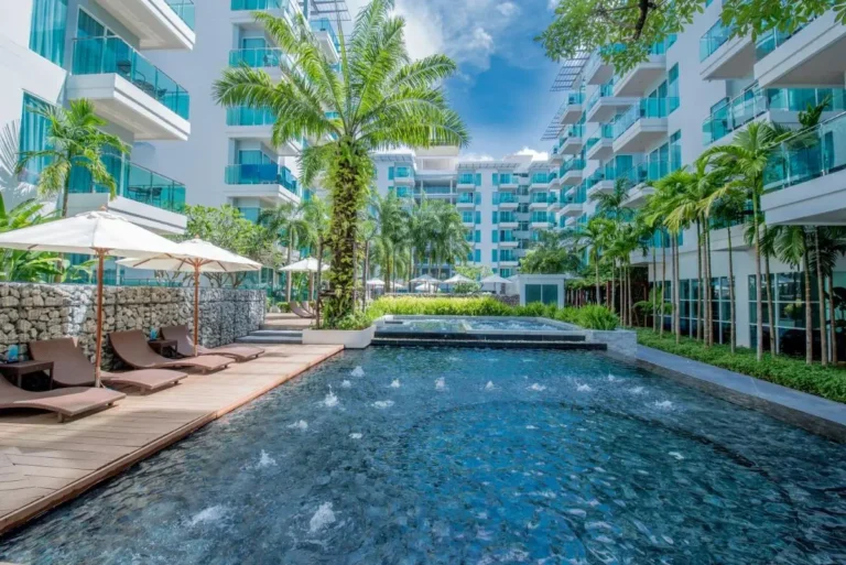 Outdoor Pool Area with Jacuzzi and Lounge Chairs at Patong Beach Residence