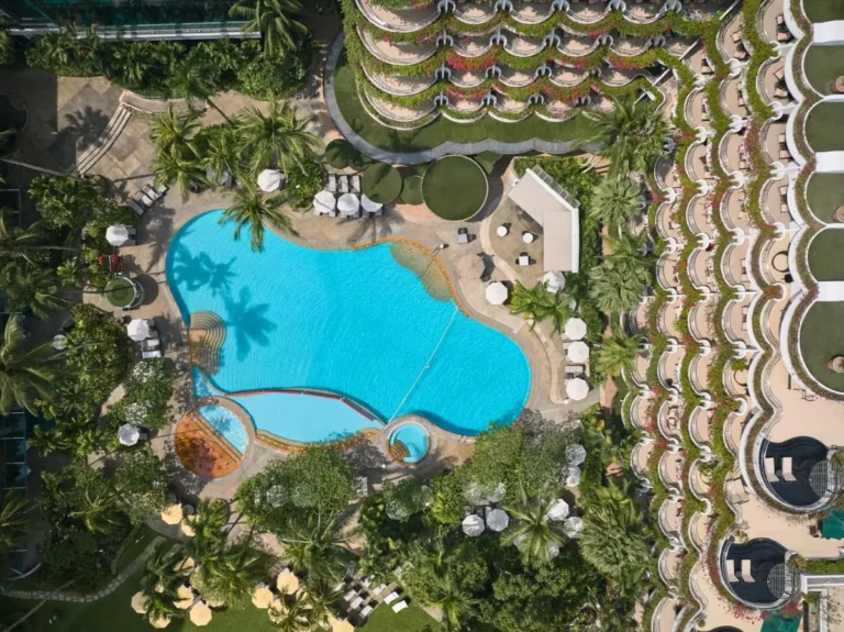 Outdoor Pool Area with Jacuzzi and Lounge Seating in Orchard Singapore