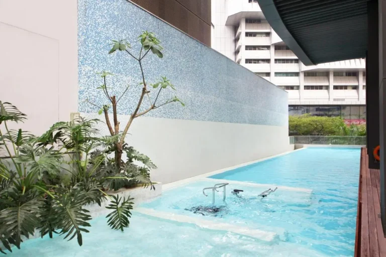 Outdoor Pool Area with Jacuzzi and Spa Features in Singapore Urban Setting