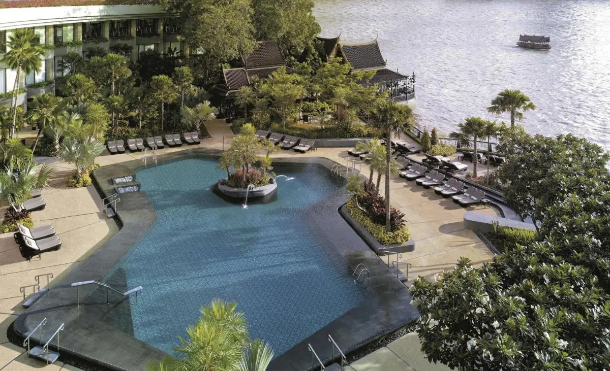 Shangri-La Bangkok Outdoor Pool Area with Jacuzzi Features and Scenic Water Views in Bang Rak