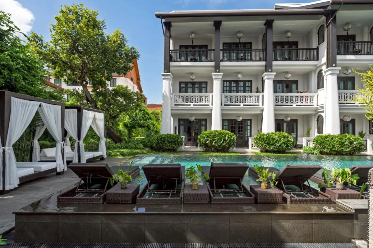 Outdoor Pool Area with Lounge Chairs and Cabanas in Phra Sing Chiang Mai