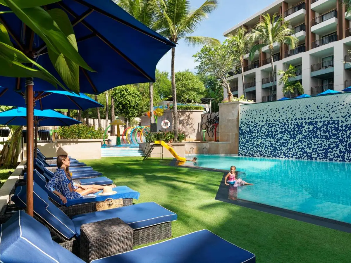 Phuket Province Outdoor Pool Area with Lounge Chairs and Children’s Water Play Features at Kata Beach