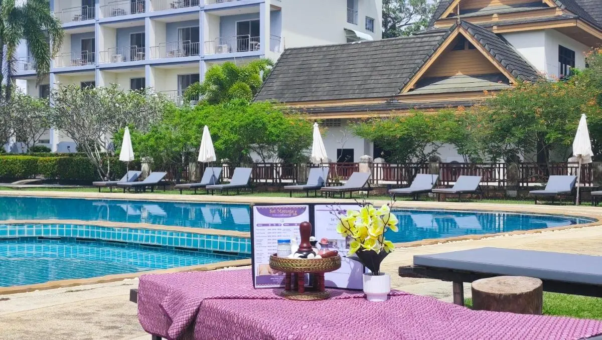 Thailand Outdoor Pool Area with Lounge Chairs and Massage Table Near Rawai Beach