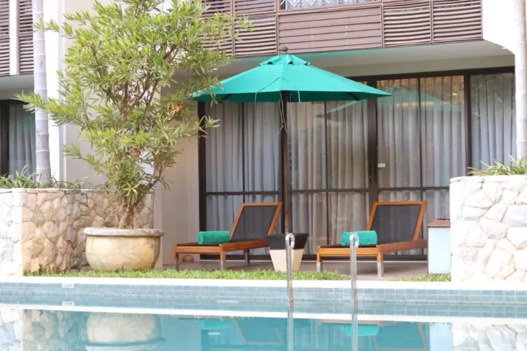 Outdoor Pool Area with Lounge Chairs and Umbrella in Chang Khlan Chiang Mai