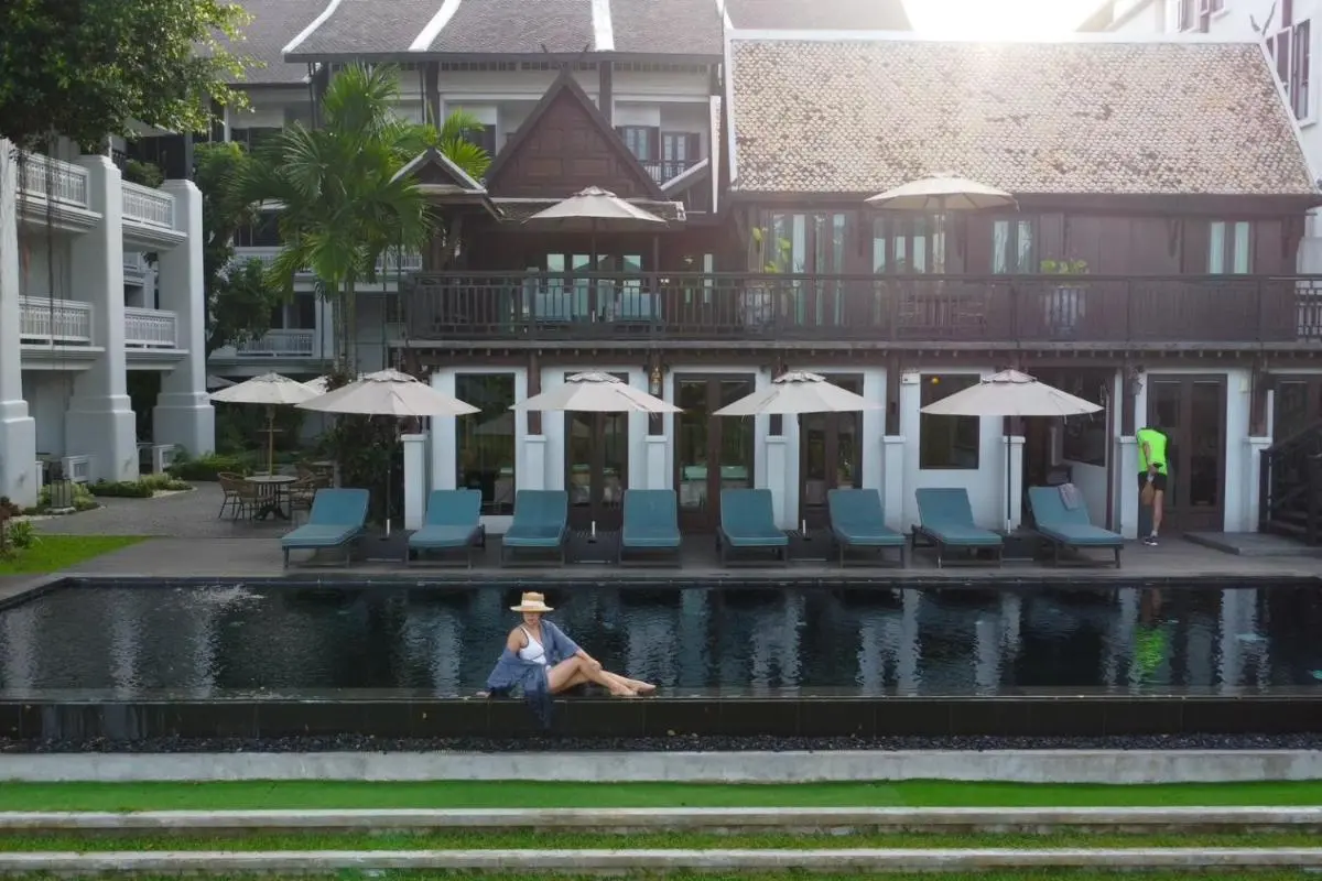 Outdoor Pool Area with Lounge Seating and Balcony in Fa Ham Chiang Mai
